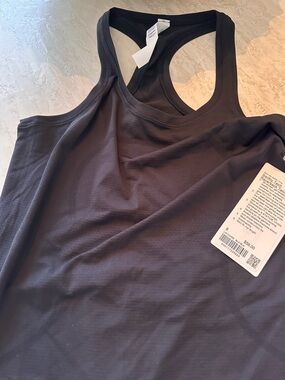 NWT; black lululemon 
Swiftly Tech Racerback
Tank Top 2.0 Hip Length